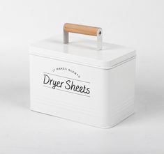 a white box with a wooden handle on the top that says, dry sheets