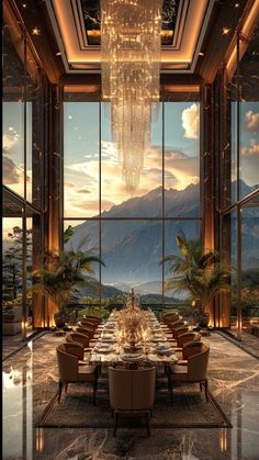 an elegant dining room with large windows and chandelier hanging from the ceiling, overlooking mountains