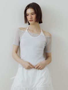 This is a minimal and feminine top by Lucirzu that is made out of high quality and sturdy material. With distinctive mood of the design and comfortable wear, you can use it for your daily lifestyle.- Trendy layered detail- Off shoulder t-shirt and halter sleeveless top set up- Silver logo embellishment detail- Modern and minimal mood Modern White Crop Top For Spring, Modern White Spring Crop Top, Casual White Tops With Minimal Stretch, Versatile White Tops For Everyday Wear, Modern White Tops For Layering, Versatile White Everyday Top, Versatile White Crop Top For Spring, Versatile White Top For Everyday, White Crew Neck Crop Top For Layering