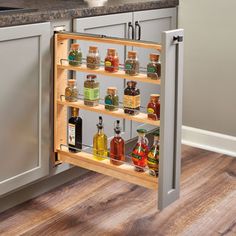 an open spice rack in the corner of a kitchen