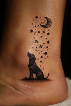 a dog sitting on the ground with stars and moon tattoo