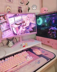 two computer monitors sitting on top of a desk with pink keyboards and mouses in front of them