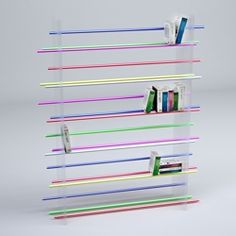 a book shelf with several different colored books on it