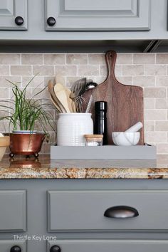 the kitchen counter is clean and ready to be used as a shelf for cooking utensils