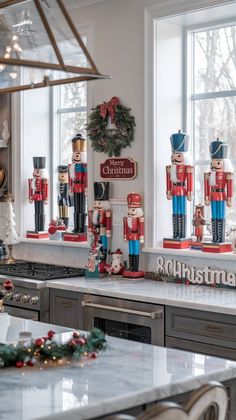 christmas decorations and nutcrackers are on display in the kitchen