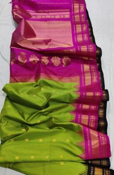 Exclusive pure Handloom Gadwal silk saree with Ganga Jamuna border. This is a beautiful parrot green saree with magenta and black borders . The saree is very unique and can be worn in any party. Green lover's don't think twice, it's hard to find this pattern. DesiModel is committed to bring you the best quality and design. Green Paithani Silk Saree For Festivals, Green Bollywood Paithani Silk Saree, Festival Green Paithani Silk Saree, Festive Green Traditional Wear With Border, Green Wedding Saree With Border, Green Anarkali Saree With Border, Green Silk Saree With Border, Green Anarkali Saree With Border Detail, Green Silk Traditional Wear With Border