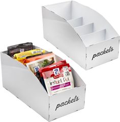 two white boxes with food in them on a white background