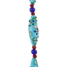 a blue beaded necklace with red, white and blue beads hanging from it's side