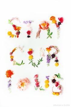 the letters are made up of flowers and leaves