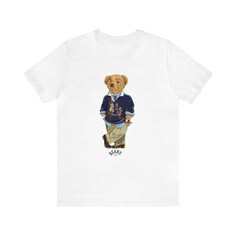 Sure, here's an Etsy listing description for the Unisex Casual Polo Bear Crewneck White Jersey Short Sleeve Tee: Welcome to our collection of timeless style and comfort! Elevate your wardrobe with our Unisex Casual Polo Bear Crewneck White Jersey Short Sleeve Tee. Crafted with care and attention to detail, this tee is destined to become your new favorite go-to piece. 🐻 Stylish Bear Design: Make a statement with our signature Polo Bear design, adding a touch of whimsy and charm to your look. Whether you're a bear lover or just love stylish animal motifs, this tee is perfect for you. 👕 Classic Fit, Ultimate Comfort: This classic unisex jersey short sleeve tee fits like a well-loved favorite from the moment you put it on. Made with 100% Airlume combed and ring-spun cotton (4.2 oz/yd² (142 g Bear Animal, Polo Bear, White Jersey, Bear Design, Easy To Love, Animal Shirts, Jersey Shorts, Timeless Style, Etsy Listing