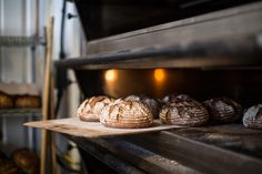 several loaves of bread sitting in an oven