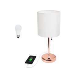 an electronic device is plugged in to a lamp next to a cell phone and charger