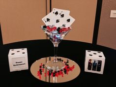 a wine glass with playing cards in it