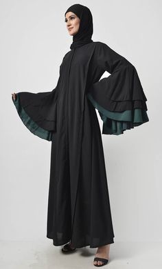 Defined by its dramatic silhouette, this piece sprinkle class add a touch of trend to your black-only wardrobe Round neck Knife pleats on princess seam Multi layer flare sleeves FABRIC: Nida CARE: Machine wash cold Our Model Is Wearing Size 'S' Modest Fitted Black Abaya, Fitted Long Sleeve Black Abaya, Knife Pleats, Flare Sleeves, Abaya Dress, 70 Dress, Everyday Dresses, Princess Seam, Womens Tunics