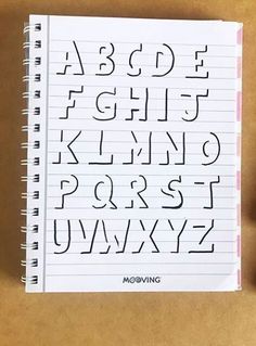 a notebook with the letters and numbers drawn on it