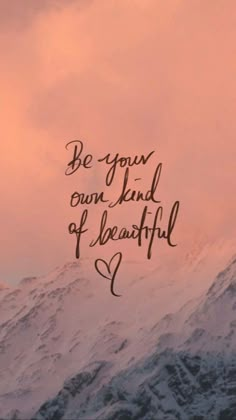 the words be your own kind of beautiful are shown in front of a snowy mountain