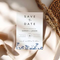 save the date card with blue flowers on it