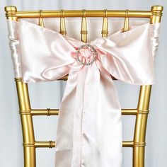 a chair with a pink sash on it