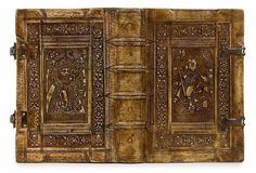 an old book with carvings on it