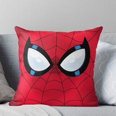 a spider - man face with big eyes throw pillow