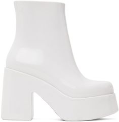 Ankle-high lightweight PVC boots in white. · Logo embossed at outer side · Zip closure at inner side · Logo printed at padded faux-leather footbed · Textured rubber interior · PVC platform midsole and block heel · Treaded PVC sole · Platform: H1.75 · Heel: H4 Supplier color: White White Boots With Padded Ankle And Round Toe, White Heeled Boots With Padded High Ankle, White Waterproof Boots, Modern White High Ankle Heeled Boots, White Synthetic Heeled Boots With Reinforced Heel, White Platform Ankle Heeled Boots, Modern White High-top Boots, White High Ankle Heeled Boots With Padded Ankle, White Platform Boots With Padded Ankle And Round Toe