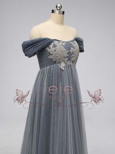 This elegant Gray Regency Bridgerton Empire Waist Lace Formal Dress is a must-have staple for your formal wardrobe. Crafted from a luxurious lace and tulle fabric, this dress has a classic 1920s Empire style silhouette that is perfect for your next Bridgerton ball, regency-themed event or grand wedding. With timeless style and endless elegance, you'll look like a true Bridgerton! Silhouette: Empire Style: Elegant Primary Fabric: Lace and Tulle Neckline: Off the Shoulder Closure: Corset Back Made Violet Bridgerton Dress, Formal Gown With Lace Sleeves And Tulle, Formal Tulle Gown With Lace Sleeves, Elegant Lace Evening Dress With Tulle Skirt, Fitted Tulle Mother Of The Bride Dress For Banquet, Lace Evening Dress With Fitted Bodice And Tulle Skirt, Elegant Tulle Dress With Lace Patchwork, Evening Lace Dress With Fitted Bodice In Tulle, Formal Fitted Tulle Mother Of The Bride Dress