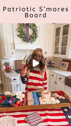 a woman standing in front of a table filled with american flags and other patriotic items