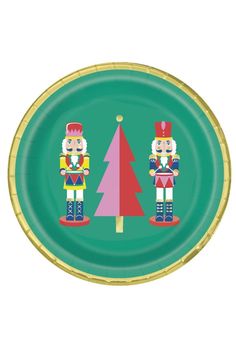 a paper plate with two nutcrackers and a christmas tree on the front