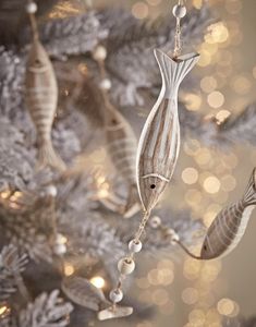 some ornaments are hanging from a christmas tree