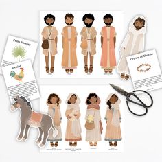 paper dolls and scissors on a table with cards about the story of jesus's birth