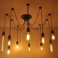 a chandelier with many light bulbs hanging from it's sides and the words,