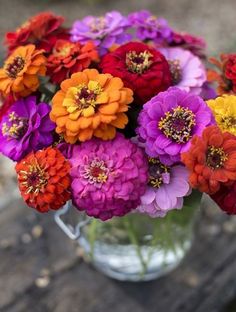 a bunch of colorful flowers in a vase