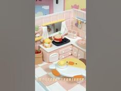 a doll house kitchen with pink furniture and accessories