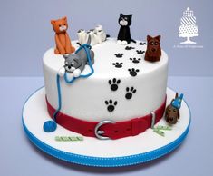 a birthday cake with dogs and cats on it