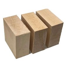 three pieces of wood sitting next to each other