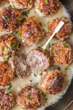 some meatballs and gravy in a skillet