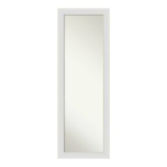 a white door with a mirror on the front and bottom panel in the back side