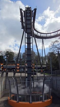 an amusement park ride with steam coming out of it