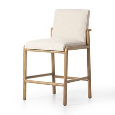 an upholstered wooden stool with a white fabric seat and backrest, viewed from the front