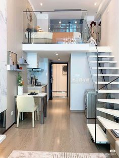 the interior of a modern apartment with stairs