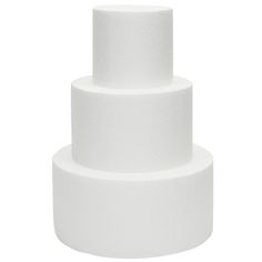 a three tiered white cake on a white background