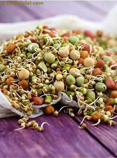 sprouts and seed mix on a wooden table