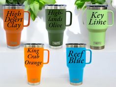 four different colored yeti travel mugs with the words high desert clay and reef blue