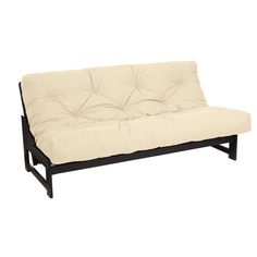 a futon sofa bed sitting on top of a white floor