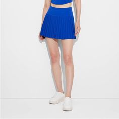 Women's Game Day Pleated Skort - Joylab Blue Small Nwt Athleisure Tennis Skirt Mid-Rise Pleated Skort Built-In Shorts Stretchy Fabric With Lining Athletic Fit Pull-On Style Recycled Polyester Product Details This Pleated Skort From Joylab In An Athletic Fit Is Designed With Built-In Fitted Shorts To Offer Additional Coverage. The Midweight Flexible Fabric With Soft Lining Lends Comfort And Freedom Of Movement Through Any Activity, While The Pull-On Style Allows For Easy Wear. Pair With A Range O Casual Spring Sports Pleated Skirt, Blue Athleisure Tennis Skirt For Spring, Stretch Pleated Skirt For Sports, Spring Season, Casual Pleated Skirt For Sports In Summer, Casual Summer Pleated Skirt For Sports, Blue Athleisure Tennis Skirt, Stretch Pleated Workout Bottoms, Blue Tennis Skirt With Short Inseam For Spring, Casual Pleated Sports Mini Skirt