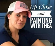 a woman wearing a pink hat with the words up close and painting with them