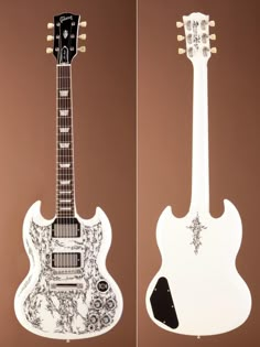 two guitars are shown side by side, one is white and the other is black