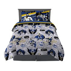 batman bedding set with blue and yellow accents on the comforter, sheets and pillow cases