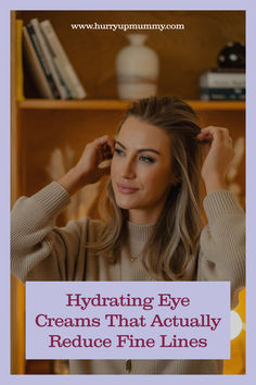 A woman with smooth skin gently touching her hair, representing the benefits of using hydrating eye cream to reduce fine lines and maintain a youthful appearance.