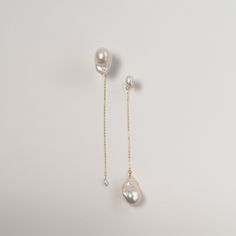 These Baroque Pearl drop earrings are perfect for those who love asymmetric designs, with the Yin Yang concept representing balance and harmony. The pearls are carefully selected for their quality, ensuring that each earring is one-of-a-kind. Wear these earrings to add a touch of elegance to any outfit, whether it's a formal wedding or a night out with friends. They also make a great gift for that special someone in your life who loves unique and beautiful jewelry. ---------------------------- Pearls: Baroque Pearls + Keshi Pearls Dimension: 14cm long, large pearls width approx 14+mm, small keshi pearls about 6mm Metal: Gold-filled chains 🤍 THE BEST VALUE BAROQUE PEARLS 🤍 Our close connections with freshwater oyster farms allow us to source pearls DIRECTLY from the framers. That's how we Luxury Handmade Dangle Pearl Earrings, Asymmetry Design, Keshi Pearl Earrings, Pearl Earrings Designs, Beads Craft Jewelry, Pearls Wedding, Pearl Earrings Wedding, Beads Craft, Freshwater Pearl Earrings